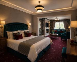 a hotel room with a large bed and a living room at The Véro Townhouse Killarney in Killarney