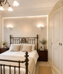 a bedroom with a large bed and two night stands at Terrazza Rossetti in Vasto
