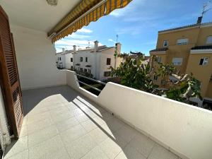 a balcony with a view of some buildings at Adosado Mar i Pins in Benicarló