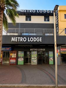 a metro lodge sign on the front of a store at Metro Lodge MP in Durban