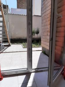 an open door to a patio outside a house at APP Amsterdamstr glv in Ostend
