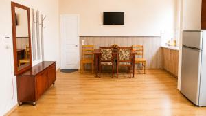 a kitchen and dining room with a table and chairs at Tuz House R6 in Bakuriani +9 photos