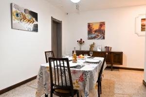 a dining room with a table and chairs at Sharon Court Guesthouse in St. Paul's Bay