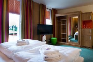 Postelja oz. postelje v sobi nastanitve Sonn'Idyll Hotel & Saunalandschaft