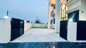 a pair of doors on a building with a courtyard at Mannat Villa Homestay in Rāmnagar +2 photos
