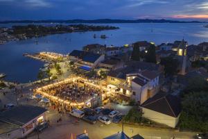 an aerial view of a city at night with lights at Campanella Old Town by Mrav in Sukošan