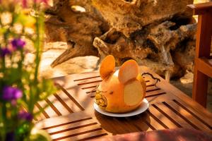 a toy mouse sitting on a plate on a table at Sunrise Mount View in Ella