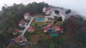 an aerial view of a house in the forest at Mountain Vista Resort in Kalpetta
