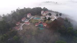 an aerial view of a house on a hill at Mountain Vista Resort in Kalpetta