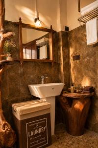 a bathroom with a sink and a mirror at Sunrise Mount View in Ella +34 photos