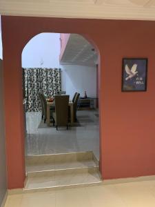 a view of a dining room with a table and chairs at FREDJACKSAIR BNb in Koforidua