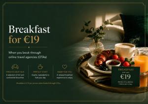 a breakfast tray with a plate of food and a cup of coffee at The Véro Townhouse Killarney in Killarney +18 photos