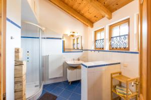 a bathroom with a sink and a shower at Schmiedlehnerhof in Birnberg +35 photos