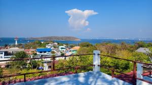 a view from the balcony of a house at Koniix Garden Cottage Ko Sichang in Ko Si Chang