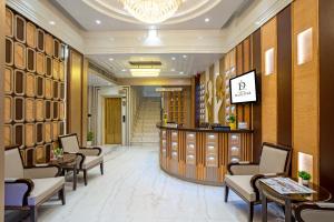 a lobby of a hotel with chairs and a bar at The Delhi Star Hotel near Connaught Place- New Delhi in New Delhi