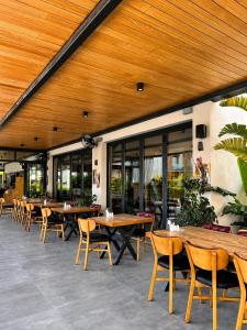 a restaurant with wooden ceilings and tables and chairs at Celeste Bella Luxury Hotel & Spa in Bodrum City