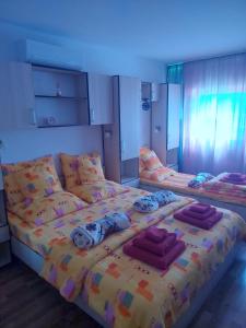 a bedroom with two beds and a blue light at DOBRA RAKIJA - transit sleep in Dobra