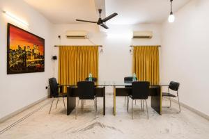 a dining room with a table and chairs at Next Generation Guest House in kolkata