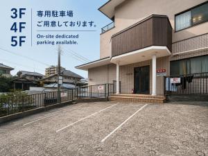 a parking lot in front of a building at NEW OPEN! Villa Piesta in Atami