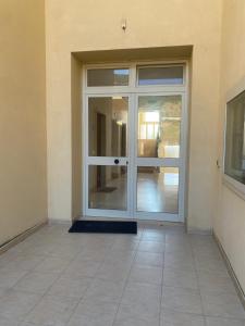 an entrance to a building with a glass door at Gioia Casa in Pizzo