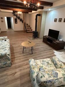 a living room with a couch and a coffee table at Chata pod hradom in Divín