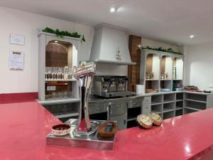 a kitchen with a counter with aasteryasteryasteryasteryasteryasteryasteryasteryastery at El abrazo de La Yecla in Espinosa de Cervera