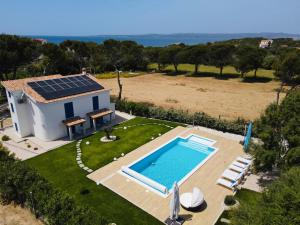 an aerial view of a house with a swimming pool at Villa Rose Sardegna in Calasetta