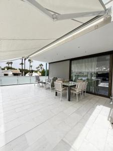 an outdoor patio with a table and chairs at Villa Capitan in Orihuela Costa