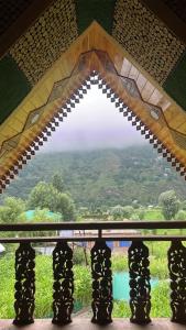 a view from a window of a mountain view at Aesthetic Homestay in Harganyiwan