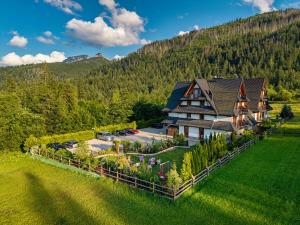 an aerial view of a large house with a garden at Hotel Eco Tatry Holiday& Spa in Kościelisko