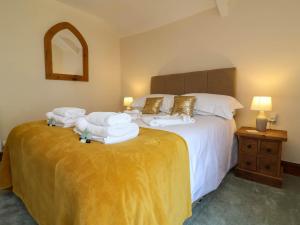 a bedroom with two beds with white towels on them at Pete's Place in Taunton +17 photos