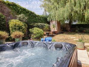 a hot tub in the backyard of a yard at Pete's Place in Taunton