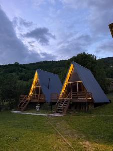 a house with a metal roof on a field at Larda in Nankvam-Zagrali