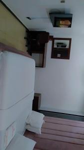 a room with a stair case and a room with a bed at Savannah Suites in Gwarinpa