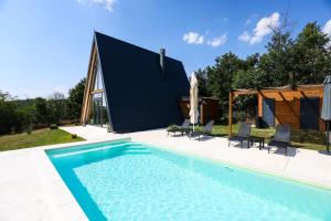 an image of a swimming pool with a house at KosMy dream in Sopot