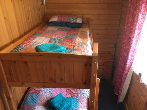a bedroom with two bunk beds in a cabin at Robins Nest in Roybridge