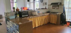 a kitchen with a counter top with a microwave at Bethany in Riche Bois