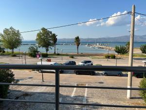 a view of a parking lot with cars parked on the street at Thalassa View VB2 in Khalkoútsion +1 photo
