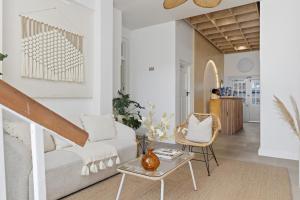 a living room with a couch and a table at Elsewhere in Cape Town