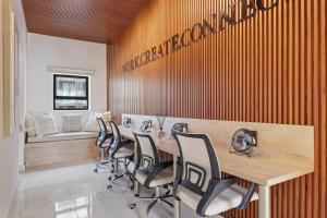 a conference room with a wooden table and chairs at Elsewhere in Cape Town +103 photos