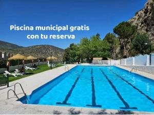 a swimming pool at a resort with a mountain in the background at El Rincón de Ani in Torres +16 photos