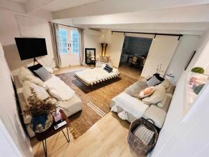 an overhead view of a living room with two couches at Marley's at Boma in Bomaderry