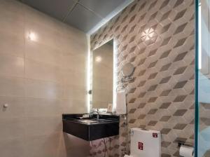 a bathroom with a sink and a mirror at Marmara Boutique in Medina +21 photos