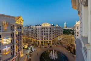 a view of a building with a bridge in a city at Boulevard Residence Suite, 3 in Tashkent