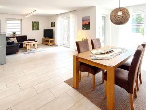 a dining room and living room with a table and chairs at Spreedeich in Werben +37 photos