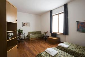 Postel nebo postele na pokoji v ubytování Residence Villa Odescalchi