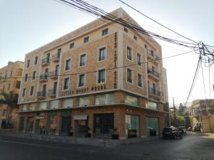 a large brick building on the corner of a street at Étoile Batroun in Batroûn