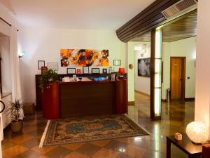 a lobby with a reception desk in a building at Hotel Adria in Mestre