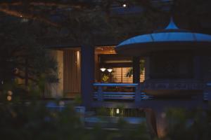 a building with a fountain in front of a window at 穴吹邸 / ANABUKI-TEI in Takamatsu