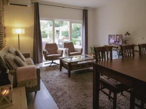 a living room with a couch and a table at Hoeve op de Meer in Maastricht